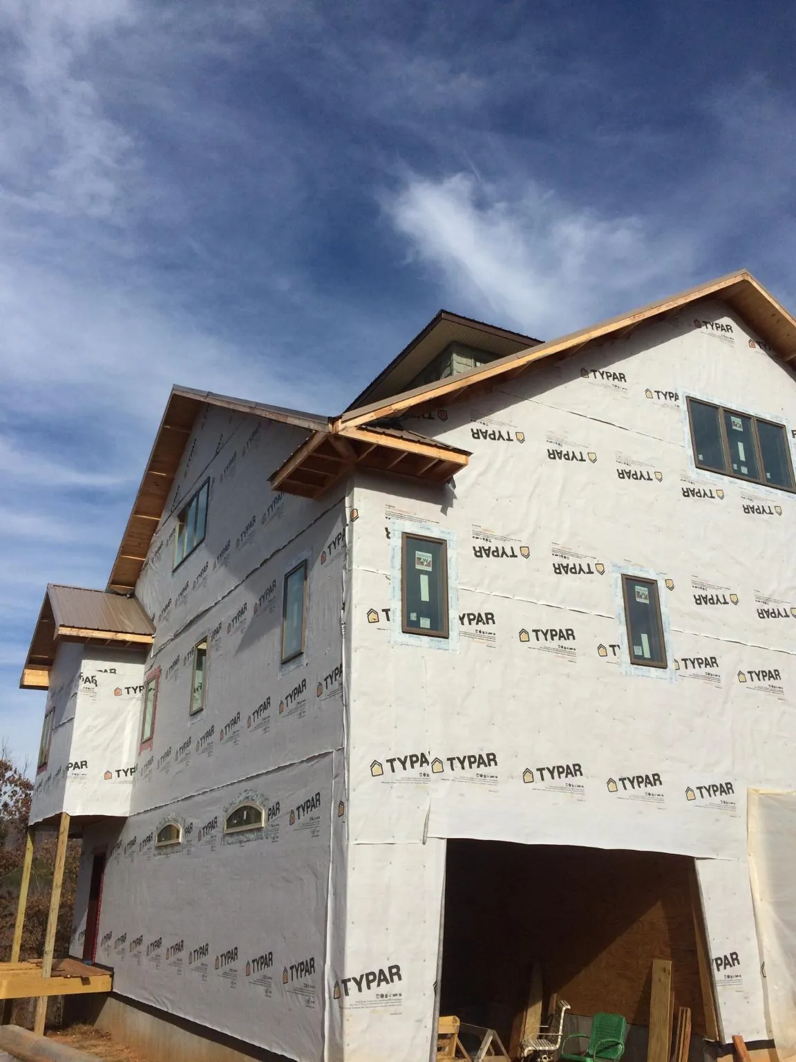 Stick built house wrapped in Typar with new roof framing and dormers in Bellevue